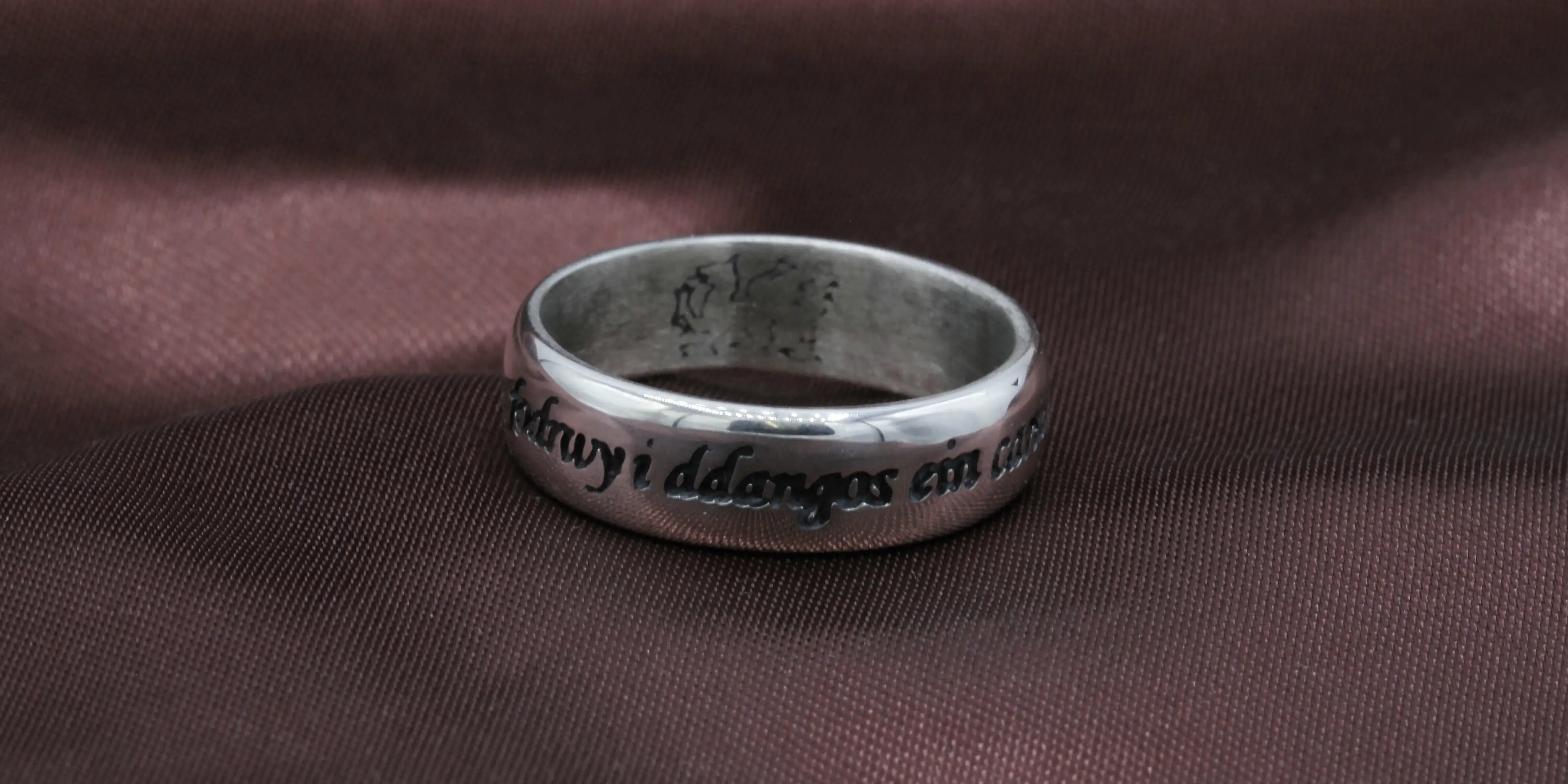 Main category image for other Jewellery depicting a ring with Welsh writing.